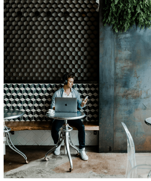 Crypto Man on laptop and phone